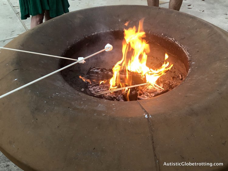 Disney Coronado Springs Resort Tips for Families roasting marshmallows in the fire