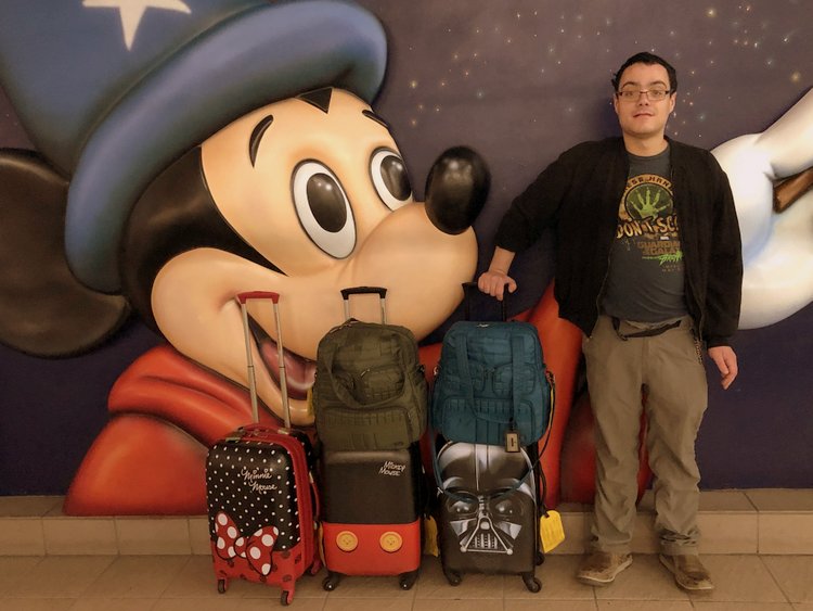 Is United MCO Red Carpet Lounge Family-Friendly suitcases near disney store mco