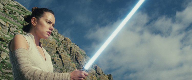 Daisy Ridley using the light saber